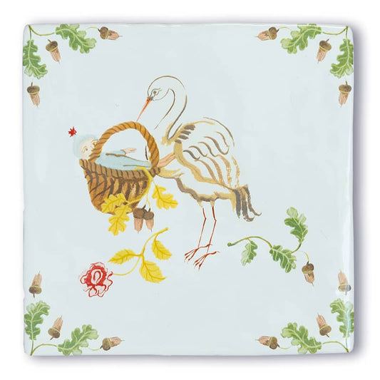 Geboortetegel ooievaar met baby in mand met bloemenrand