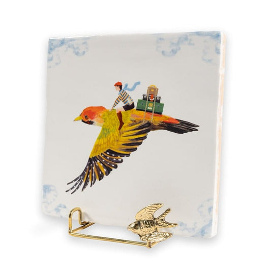 Gouden tegelhouder met een vogel en mens op tegel