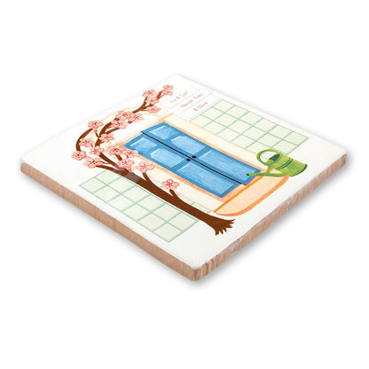 Huisnummer tegeltje met blauwe deur en roze bloesemtak