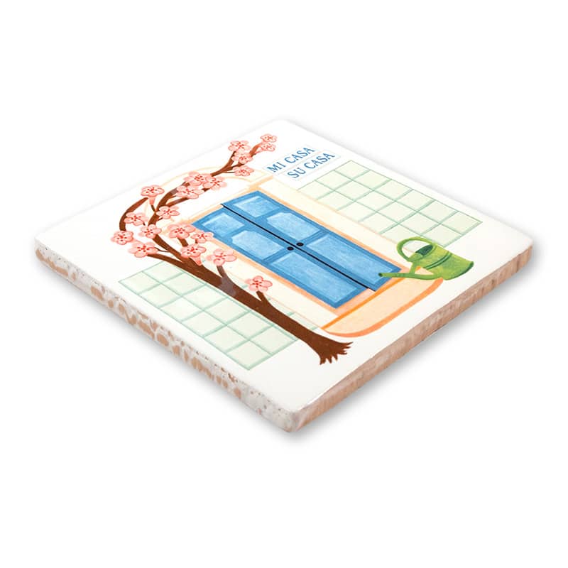 Tegeltje met blauwe deur, boomtak, groene gieter, tekst bovenaan